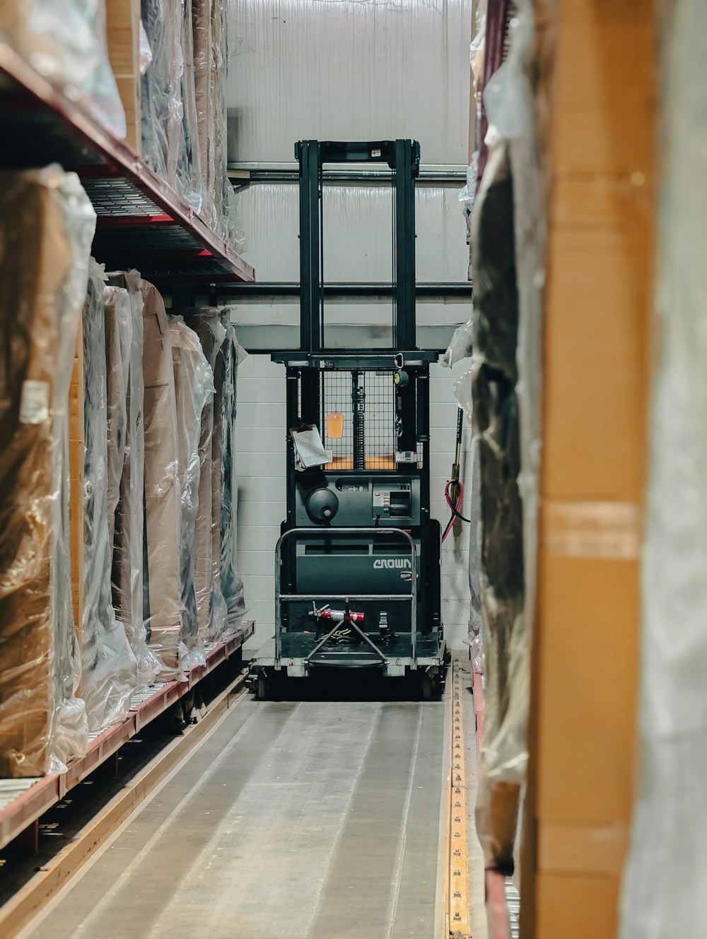Stacked cartons and pallets in a warehouse